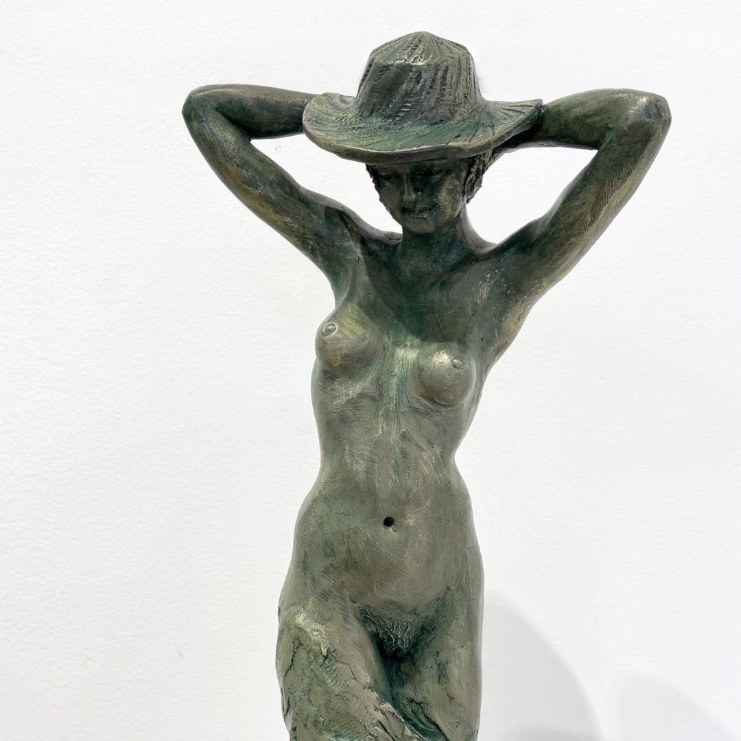 Roderick Burgess bronze sculptor artist at Parnell Gallery. Sculpture titled Lady in a Hat.